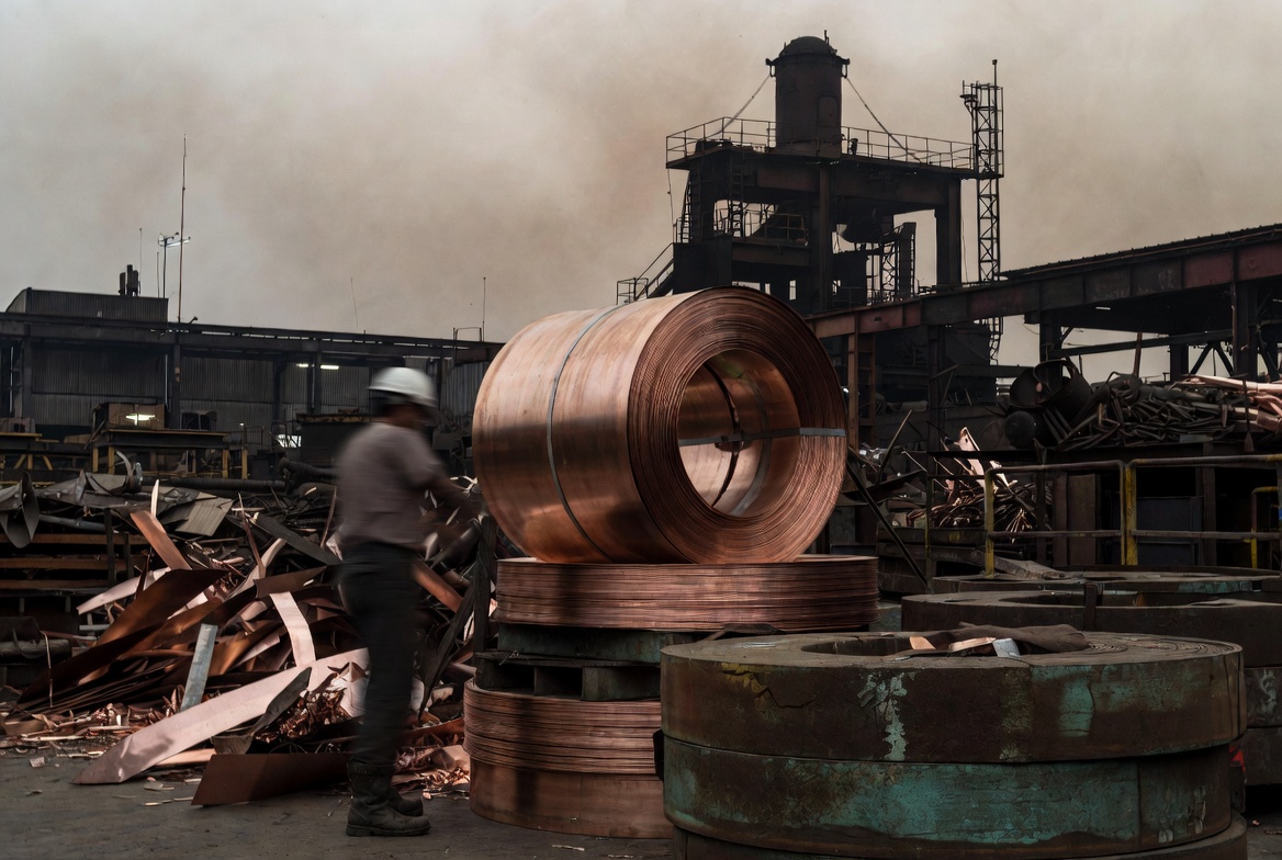 Copper coil rolls stacked at an industrial metal processing facility
