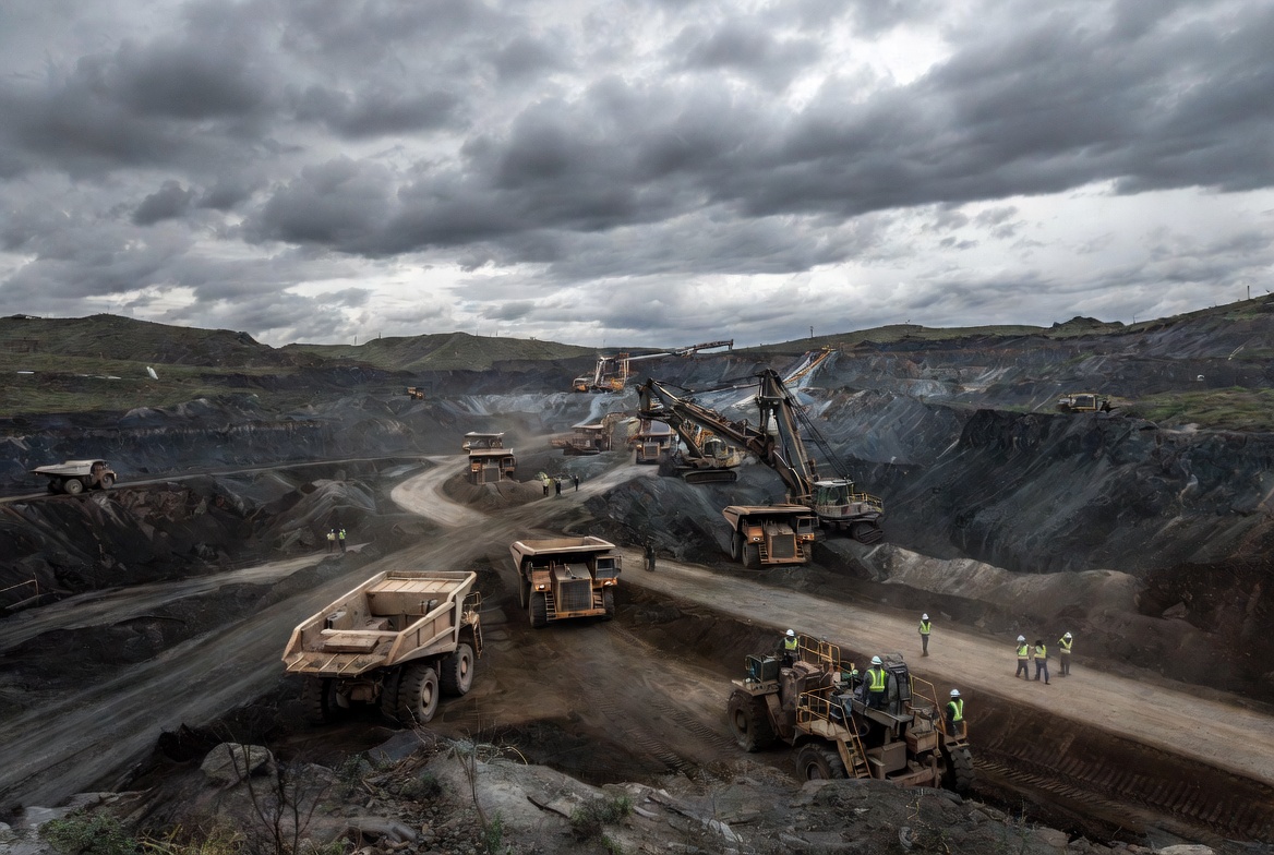 Large-scale open pit copper mining operation with heavy trucks