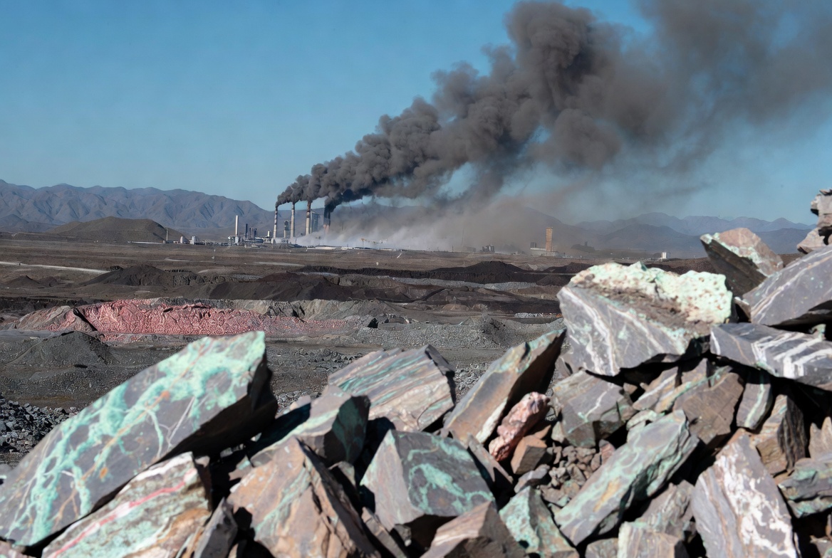 Industrial copper smelting facility with smokestacks