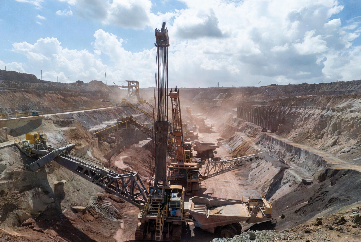 Wide panoramic view of a massive open pit copper mine